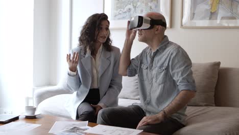 Excited-man-looking-at-interior-design-via-VR-technology